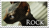 A stamp of an image of a hairless cat and text that says Rock.